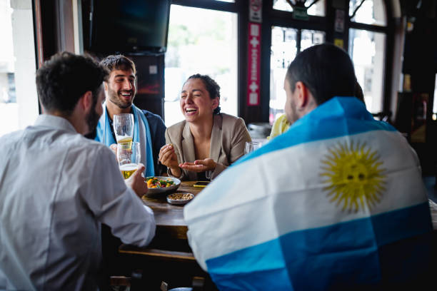 istock Colleagues gathering in the pub after work, watching a soccer game 1193505149