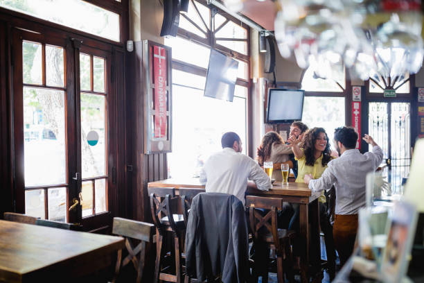 istock Friends gathering in pub, watching a soccer game 1193505175