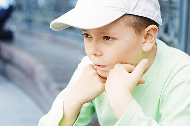 istock Pensive boy in green 119350690