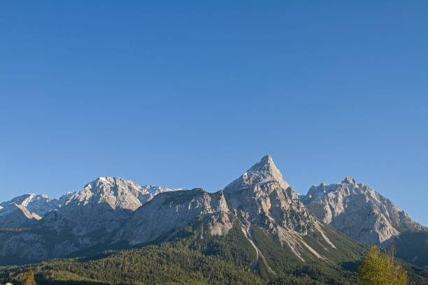 istock Sun tip - ominant mountain form in the Ehrwald basin 1193507423