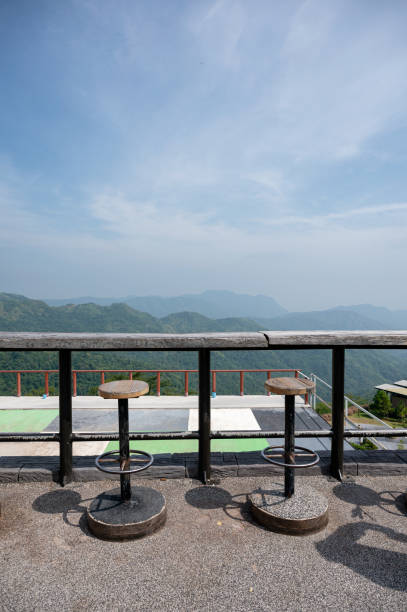 istock Wooden bar with chairs on mountain view with blue sky 1193508843