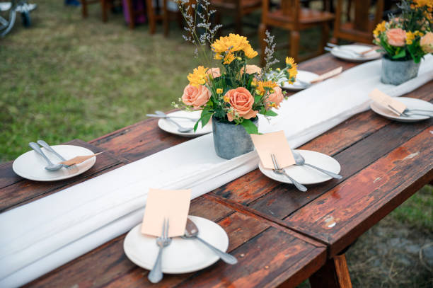 istock Rustic wedding style, Wooden dining table with flowers decoration and tableware 1193508866