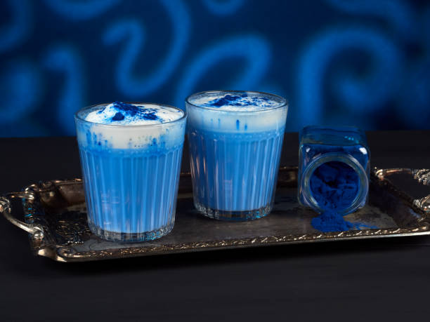 Blue spirulina latte on dark blue background stock photo