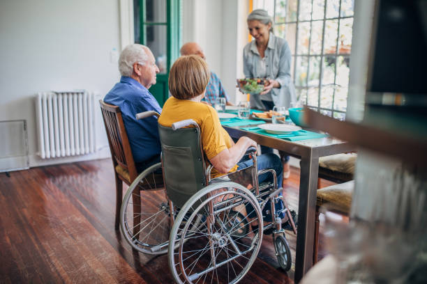 istock Four senior people having dinner together 1193510617
