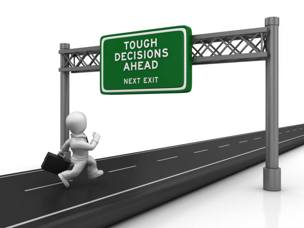 istock Road with TOUGH DECISIONS AHEAD Highway Sign - 3D Rendering 1193510743