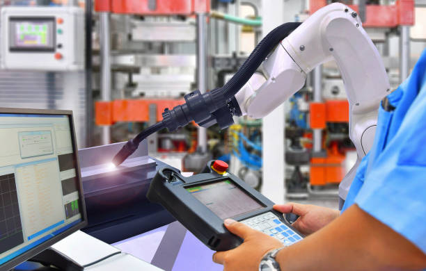 istock Engineer check and control modern high quality automation welding robots arm 1193512752