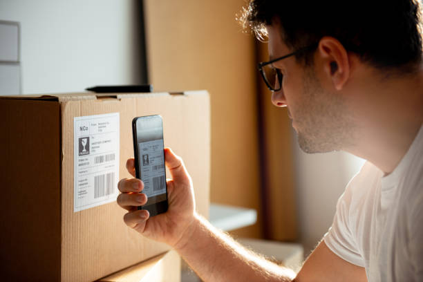 istock Delivery service, scanning a shipping label 1193513476