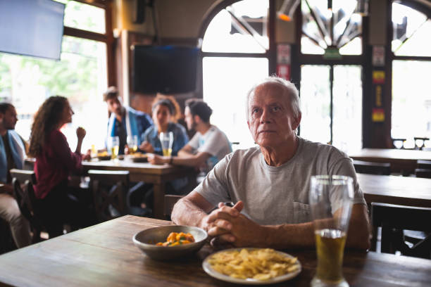 istock Friends watching soccer match 1193513867