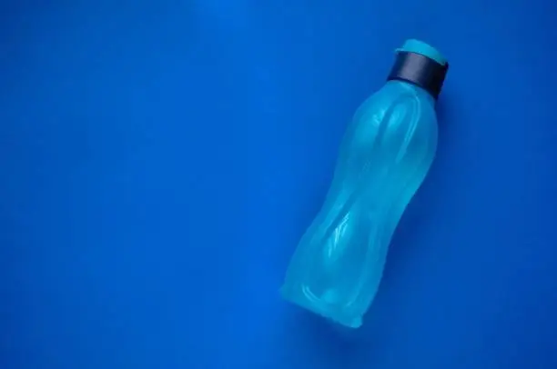 Photo of Eco bottle classic blue color. Tool for fitness.