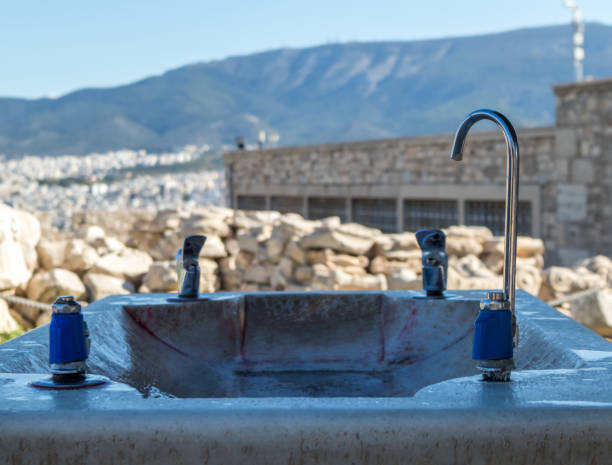 Outdoor faucet with drinking water. metal taps for guests. With long and short water pipe