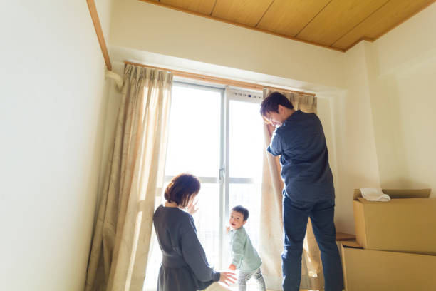 istock Asian young family in empty new house 1193522930