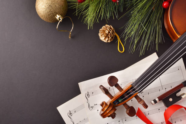 istock Violin with bow and sheet music on black background top 1193524065