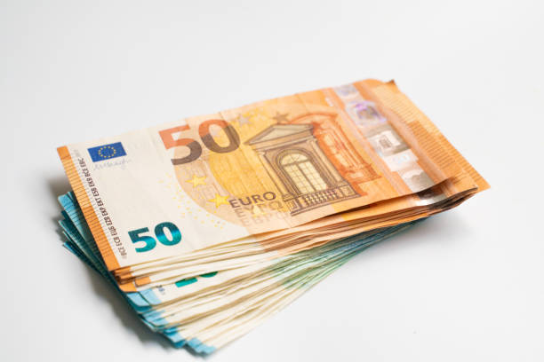 istock Euro bill money note pile bundle on white background business finance 1193527500