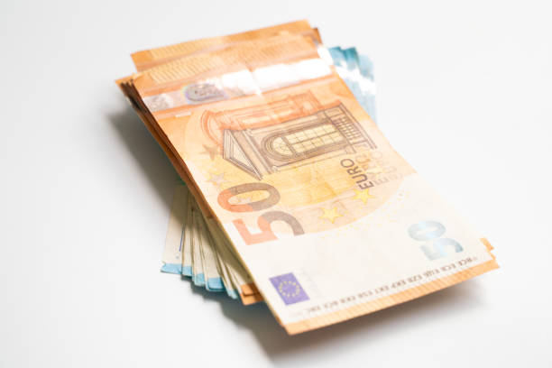 istock Euro bill money note pile bundle on white background business finance 1193527651