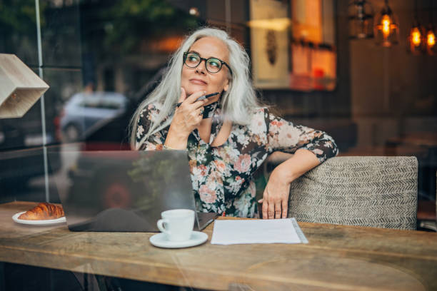 istock Lady author sitting in cafe alone 1193528860