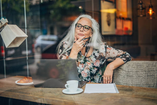 istock Woman author sitting in cafe 1193528944