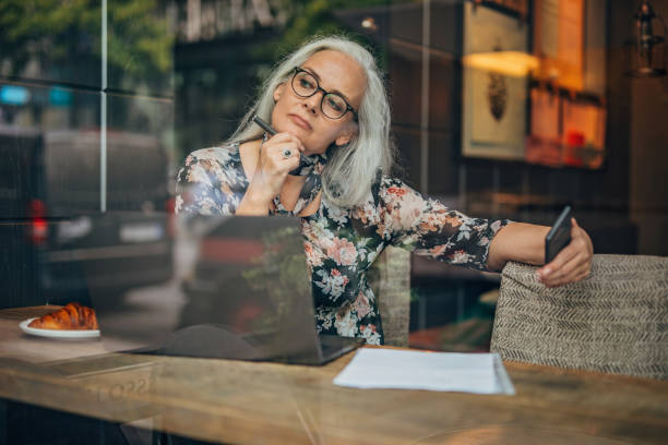 istock Modern woman sitting in cafe alone 1193531748