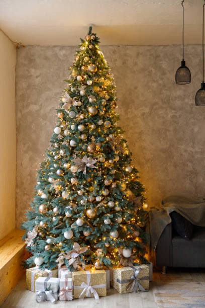 istock Beautiful Christmas tree decorated with toys and gift boxes 1193533271