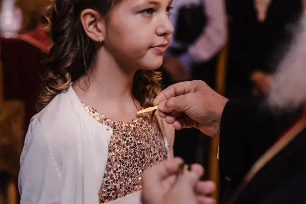 Young girl at her christening ceremony at church