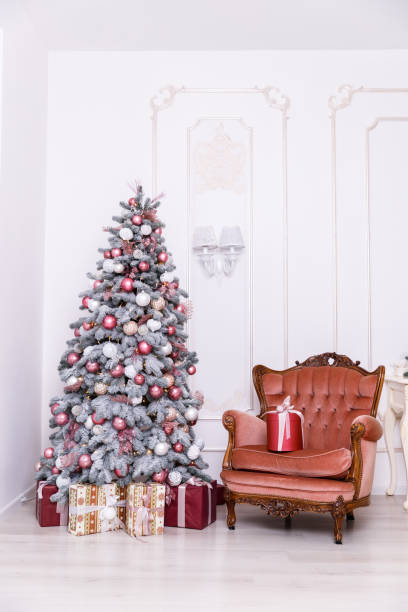istock Beautiful Christmas tree decorated with toys and gift boxes 1193533433