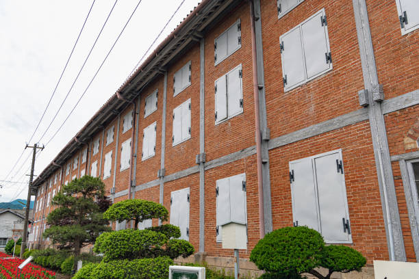 Tomioka, Gunma, Japan - May 29 2019 : East Cocoon Warehouse of the Tomioka Silk Mill. Tomioka Silk Mill is Japan's oldest modern model silk reeling factory, established in 1872.