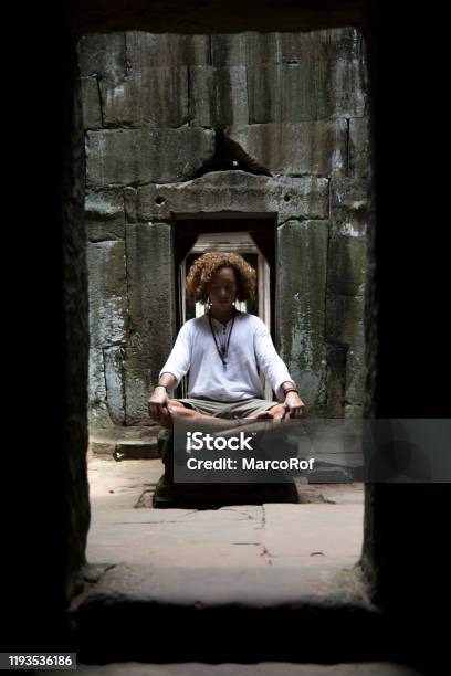 One Young Man Walking Around The Ruins Of Angkor Wat Stock Photo - Download Image Now