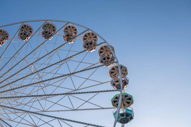istock Beautiful ferris wheel in front of blue cloudless sky 1193536762