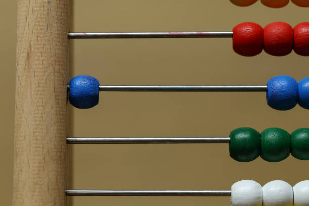 istock Children's colorful abacus for counting with multi-colored wooden beads 1193537777