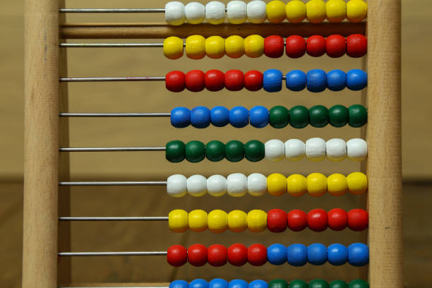 istock Children's colorful abacus for counting with multi-colored wooden beads 1193537797