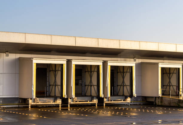 istock Logistic warehouse truck loading gates. Distribution warehouse building doors 1193539210