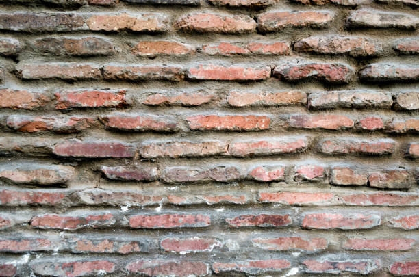 istock pattern texture of old vintage orange brick wall close up 1193539783