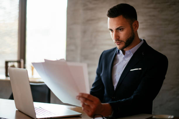 istock Handsome businessman in blue suit at the office. 1193541771