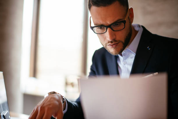 istock Handsome businessman in blue suit at the office. 1193542273
