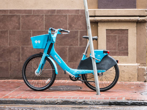 New Orleans, USA. December 2019. Row of many blue bicycles bikes on rack bike share
