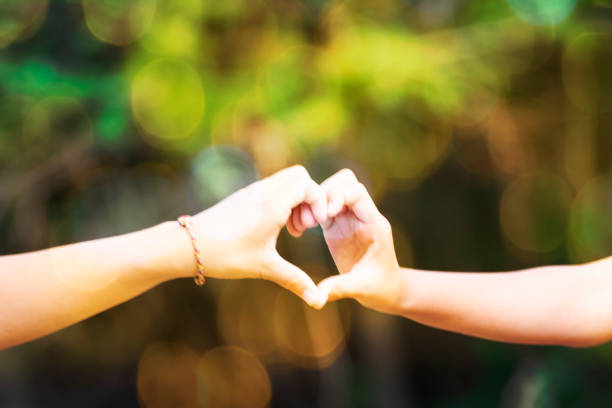 istock two hand love together  symbol close up background 1193545133