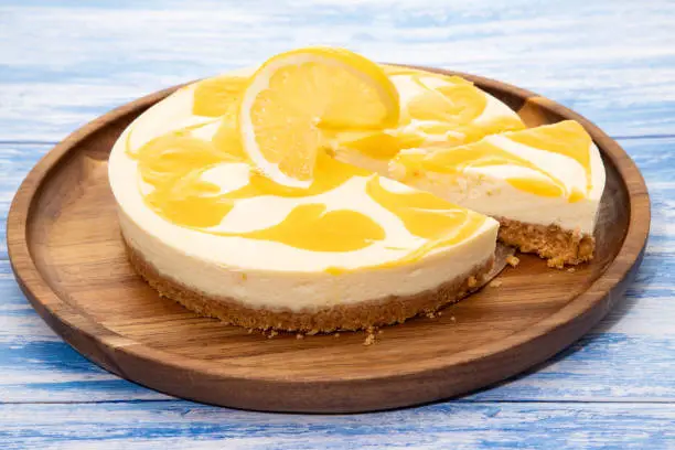 Lemon cheesecake on a wooden platter