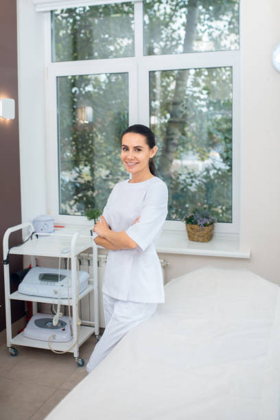 istock Famous plastic surgeon standing near window in her spacious room 1193548511
