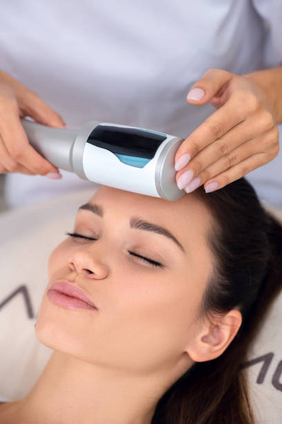 istock Young woman feeling satisfied while having ultrasound massage 1193548569