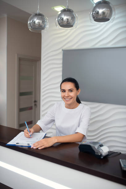 istock Beauty salon manager smiling while enjoying her work 1193548586