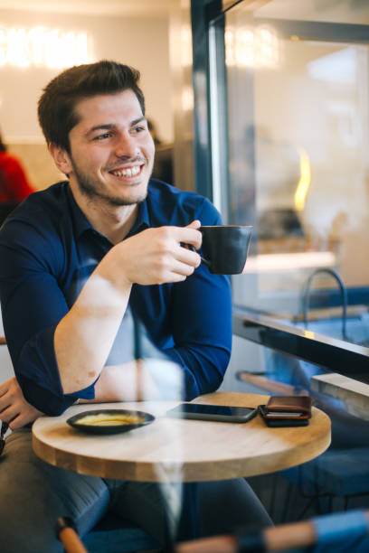 istock Business man drinking coffee in a cafe 1193550227