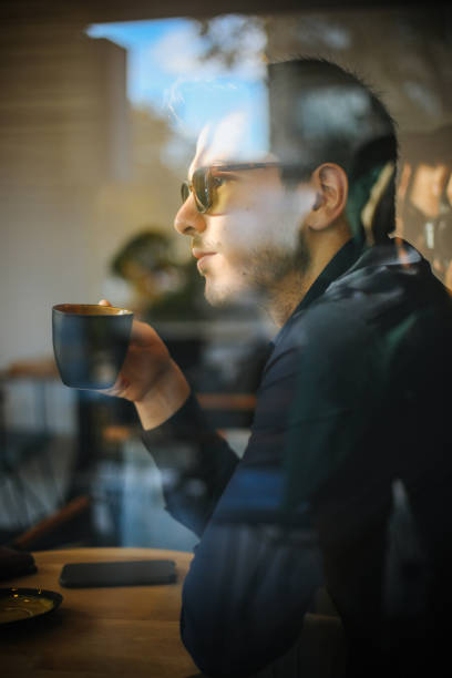 istock Business man drinking coffee in a cafe 1193551274
