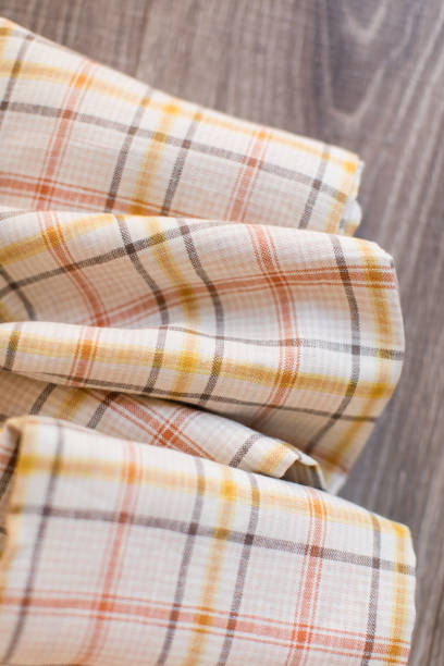 istock Cream, Orange & Yellow Plaid Material 1193551432
