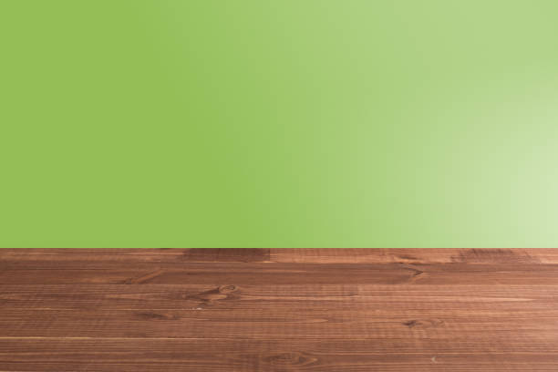 istock Wooden board empty table in front of a blurred background. Perspective brown wood with a blurry multi-colored background 1193551716