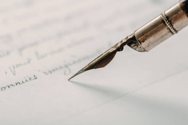 istock fountain pen on paper with ink text closeup 1193551803