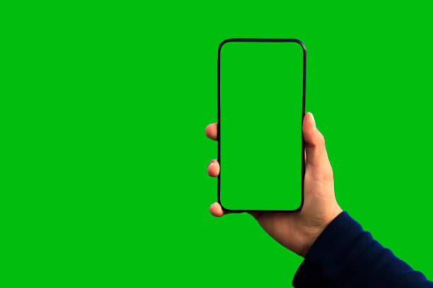 Green Screen Handheld Smartphone Green Screen Handheld Smartphone chroma key stock pictures, royalty-free photos & images