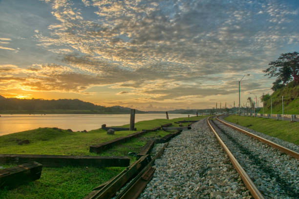 Beautiful Sunset Over the Chagres River and Panama Canal in Soberania National Park of Gamboa, Panama in Central America Beautiful Sunset Over the Chagres River and Panama Canal in Soberanía National Park of Gamboa, Panama. soberania national park stock pictures, royalty-free photos & images