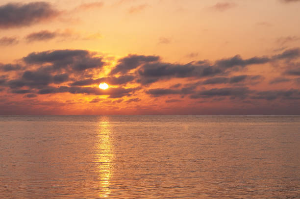 Sea waves. Sea of Crimea. High waves at sunset. Sunny day at sea. Background blue waves. Sand beach. Clean beach.