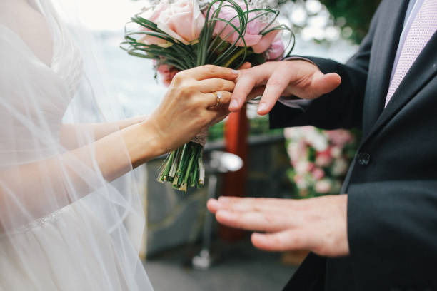 istock bride and groom holding hands 1193554918