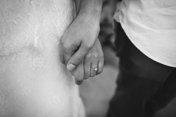 istock bride and groom holding hands 1193555762