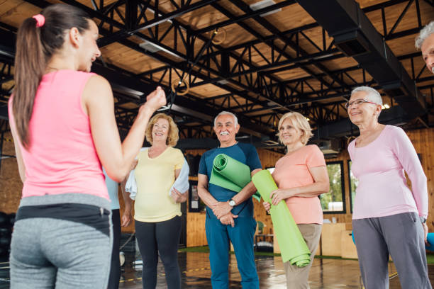 istock Group of happy seniors before their yoga class 1193556281